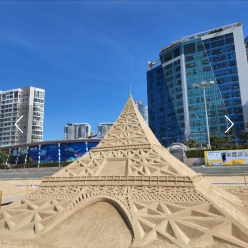 a sand sculpture of the eiffel tower in a city at Hotel Haeundae Elysia in Busan
