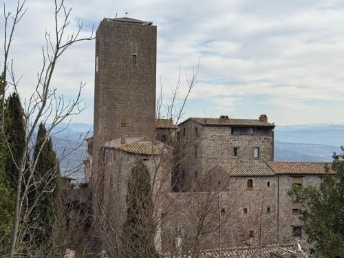 an old building with a tower on top of it at Casa Matilde in Bassano in Teverina