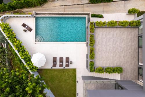 an overhead view of a swimming pool in a building at Green Lotus Samui in Ban Bang Po