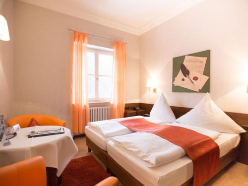 Postel nebo postele na pokoji v ubytování Hotel Müller