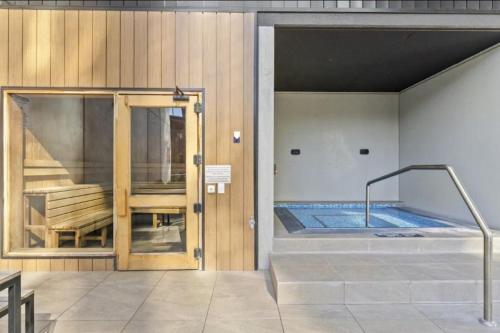a room with a hot tub in a building at Panoramic Lake View 2-Bed with Pool, Gym and BBQ in Belconnen