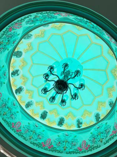 a blue and white plate with a spider on it at shikary's palace near charminar in Hyderabad