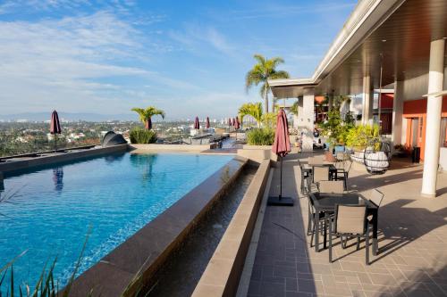 a swimming pool on the side of a building at Dtoscana Residencial-Nuevo Vallarta in Nuevo Vallarta