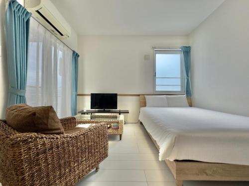 Una cama o camas en una habitación de Little Island Okinawa Nago