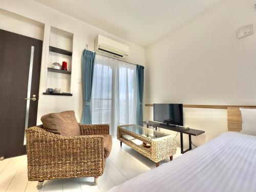 TV a/nebo společenská místnost v ubytování Little Island Okinawa Nago