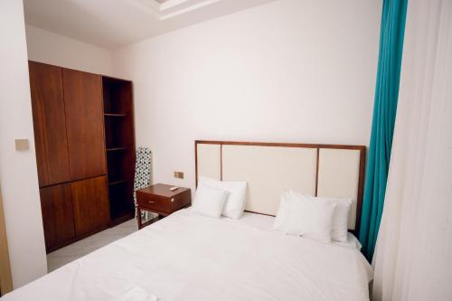 Katil atau katil-katil dalam bilik di Eshuko Palace Apartments