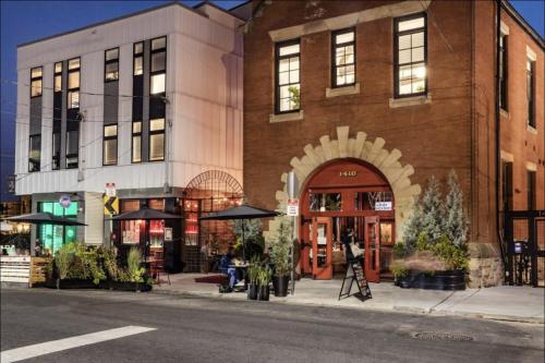 a brick building with an archway on a city street at The Frankford Fishtown in Philadelphia