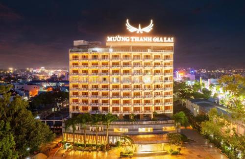 a hotel building with a sign on top of it at Khách Sạn Mường Thanh Grand Gia Lai in Pleiku
