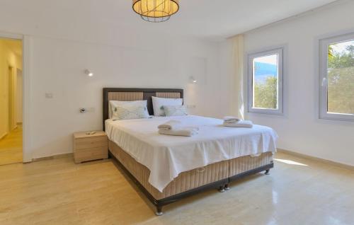 a bedroom with a large bed with two towels on it at Stella Sea View & Access to Sea in Kas