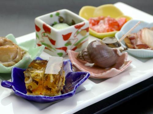 a tray with different types of food on it at Iwanai Kogen Hotel in Iwanai