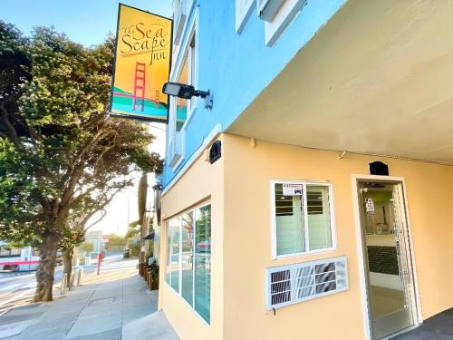 a building with a sign on the side of it at The SeaScape Inn in San Francisco