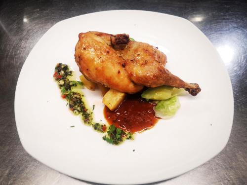 a plate of food with a chicken and vegetables at ibis Hong Kong North Point in Hong Kong