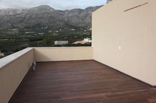 a balcony with a view of a mountain at Amorelia Casa in Lefkogeia