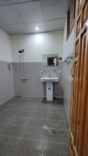 a bathroom with a sink and a shower at Sanctuary Resort Hunza in Hunza Valley