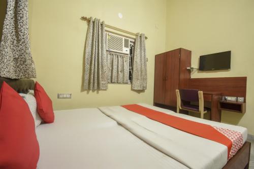 Postel nebo postele na pokoji v ubytování Hotel O RS Guest House