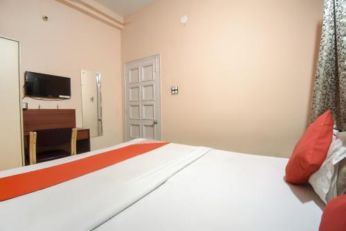 Postel nebo postele na pokoji v ubytování Hotel O RS Guest House