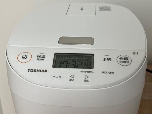 a machine with a clock on top of it at Feliz Kumamoto in Kumamoto