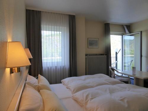 Ένα ή περισσότερα κρεβάτια σε δωμάτιο στο Hotel Garni Günther