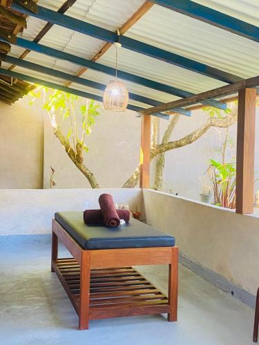 a bench with a teddy bear sitting on top of it at Mudliyar House in Hikkaduwa