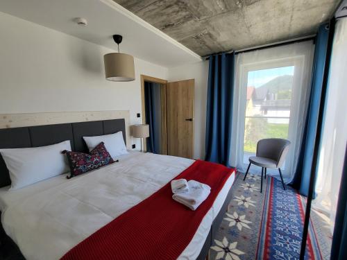 Postel nebo postele na pokoji v ubytování USTROŃ RESIDENCE by VillaOlimpijska2