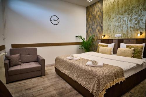 Postel nebo postele na pokoji v ubytování Hotel Amel Rooms