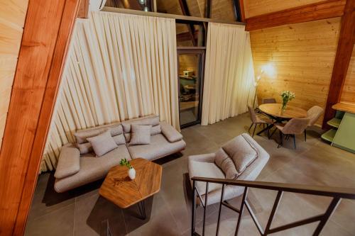 a living room with a couch and a table at V Peaks Family A Frames in Dilijan in Dilijan