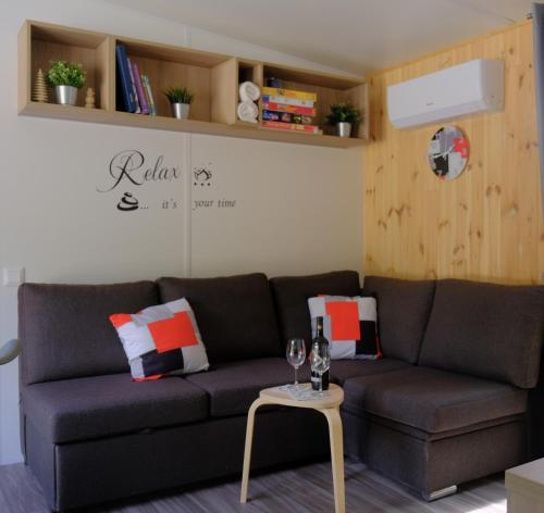 a living room with a couch and a table at Tinyhaus Sankt Rupert Nummer 11 in Riedenburg