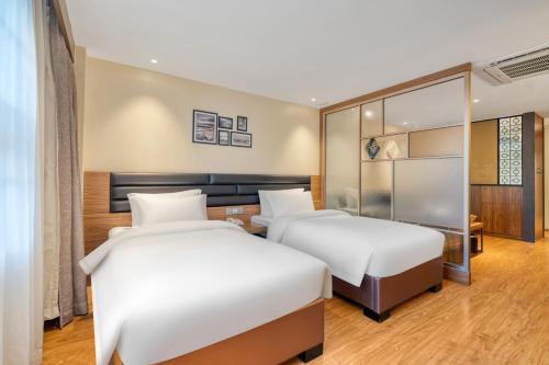 Cama o camas de una habitación en Dayhello Hotel Shenzhen Shekou