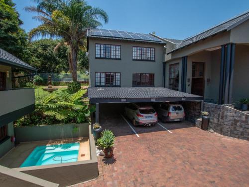 an aerial view of a house with a swimming pool at Casa Albergo Corporate Guest House in Pretoria