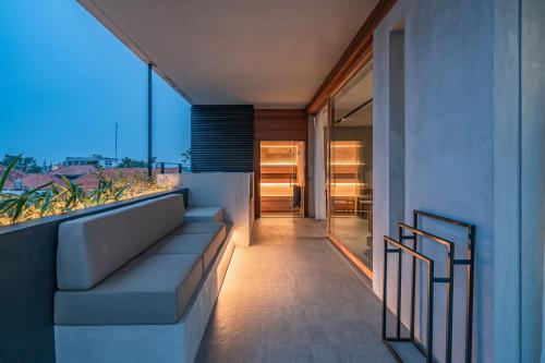 a balcony of a house with a view at Body Factory Lifestyle Residence in Canggu