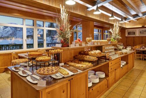 a bakery with many different types of food on display at Grand Hotel Misurina in Misurina