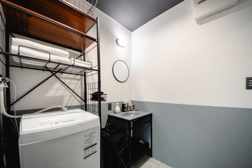 Ένα ή περισσότερα κρεβάτια σε δωμάτιο στο Private House Hibiki