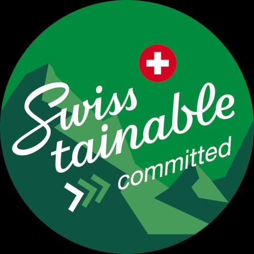 a green sign with a red cross and the words stress franchisemitted at Appartement fraîchement rénové à Crans-Montana, vue imprenable in Crans-Montana
