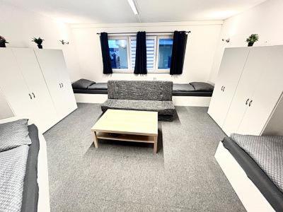 a living room with a couch and a coffee table at Apart Residence KK in Glinde