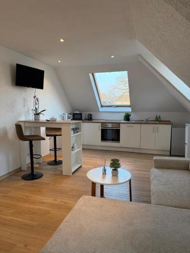 a living room with a couch and a table at Schickes Apartment am Rhein in Koblenz