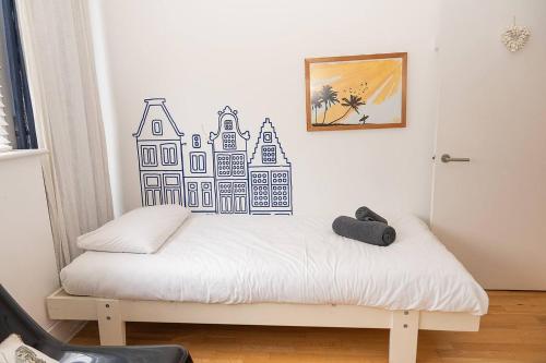 a bedroom with a bed with a drawing on the wall at Pass the Keys Royal Sands - A Beachside Haven in Camber