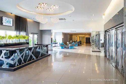 a lobby of a building with a large room with a lobby at CHIC ROOM pasay sea residence in Manila