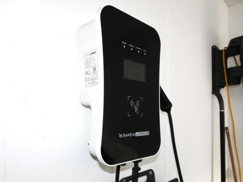 a black and white phone hanging on a wall at Apartment Rosalie by Interhome in Hart im Zillertal