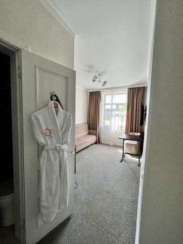 Postel nebo postele na pokoji v ubytování Hotel FN Shymkent
