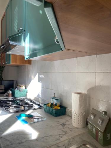 a kitchen with a stove top and a counter top at Domvs Erminia in La Spezia