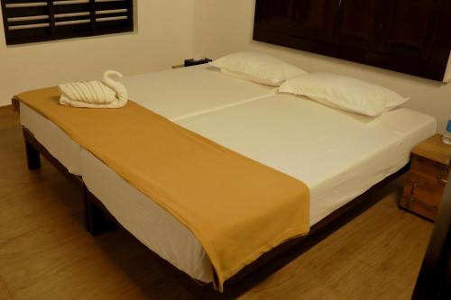 Postel nebo postele na pokoji v ubytování Mulanthanam resorts and Home stay