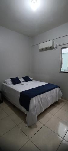 Ένα ή περισσότερα κρεβάτια σε δωμάτιο στο Apartamento no centro de Castanhal