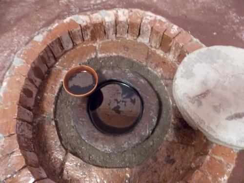 a brick spiral staircase with a ring in the middle at Guest House Wine in Sighnaghi