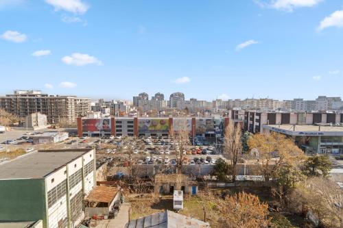 a view of a city with a parking lot at Bucharest Mall View in Bucharest