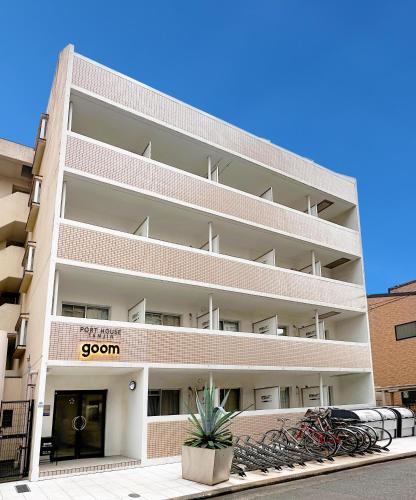 an apartment building with bikes parked outside of it at goom Hotel Fukuoka-Kokusai-Center in Fukuoka