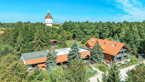 an aerial view of a house with a tower at Róża Wiatrów in Węgorzewo