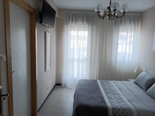 Postel nebo postele na pokoji v ubytování Albergue Agarimo