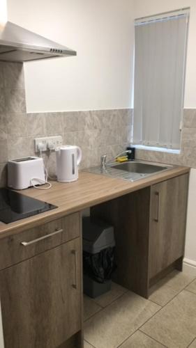 Η κουζίνα ή μικρή κουζίνα στο Lancaster Apartment