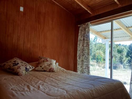 Postel nebo postele na pokoji v ubytování Casa Chiloé 3 Dormitorios