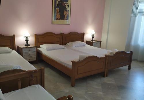 Posteľ alebo postele v izbe v ubytovaní Grivas Apartments